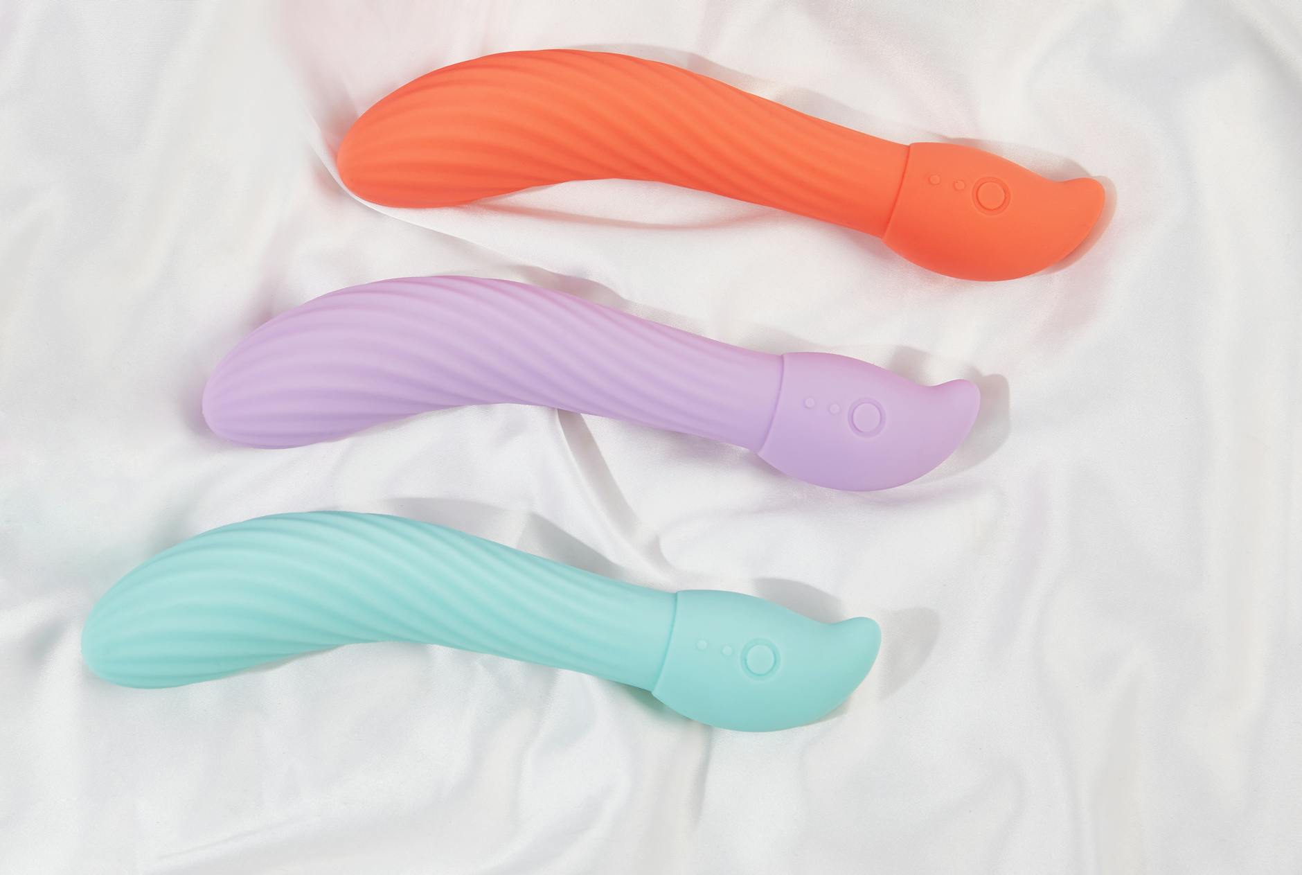 Close-up of a hand holding a vibrator, representing modern sexual wellness solutions